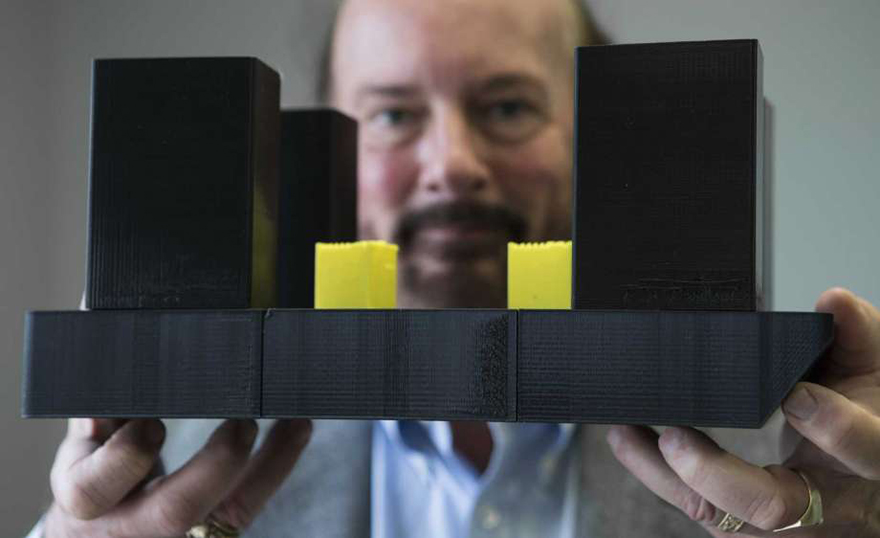 Art Schroeder holding model
